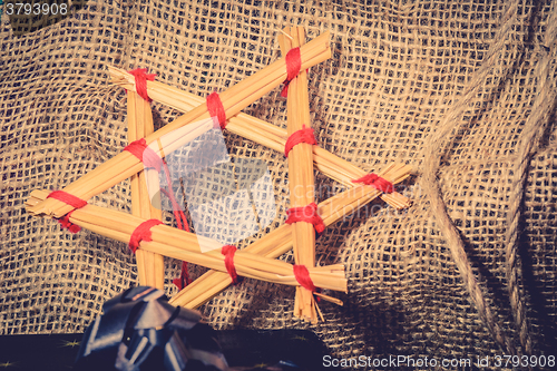 Image of Christmas star made of straws