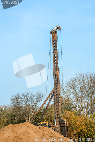 Image of Industrial machine drilling holes