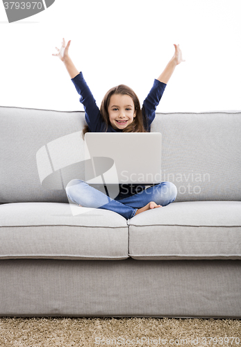 Image of Little girl working with a laptop