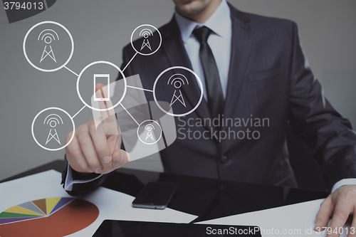 Image of businessman pressing communication button on virtual screen. social network. business concept.