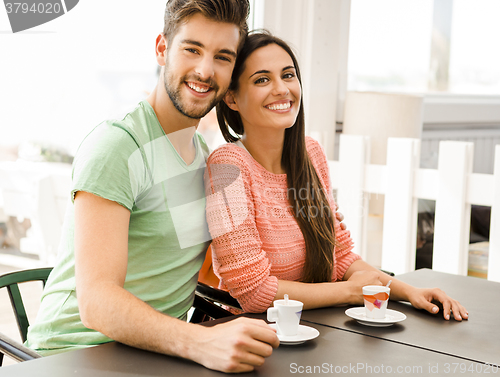 Image of Young couple drinking coffee