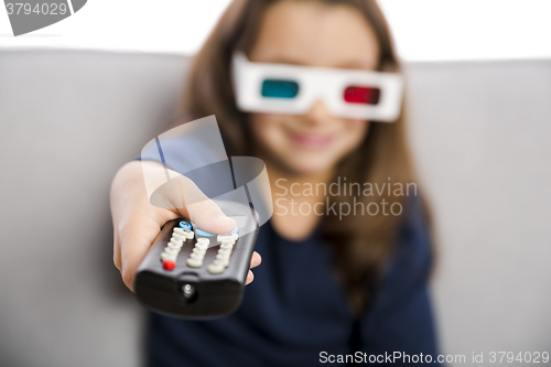 Image of Girl holding a TV remote