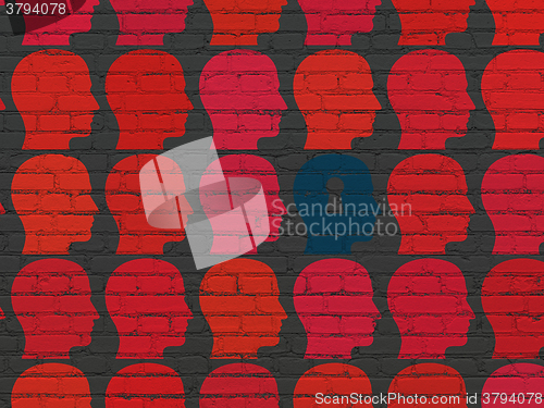 Image of Business concept: head with keyhole icon on wall background