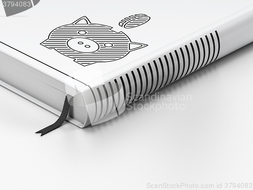 Image of Money concept: closed book, Money Box With Coin on white background