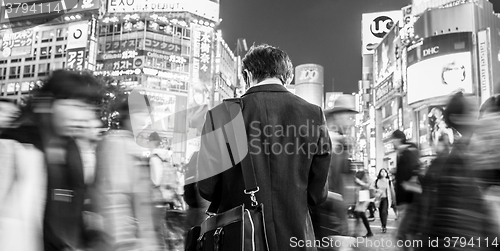 Image of Japanese businessman in Shibuya, Tokyo, Japan.