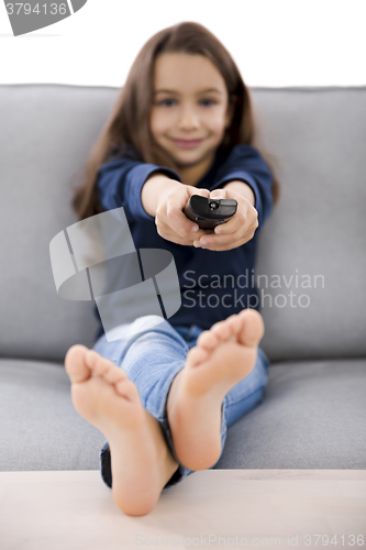 Image of Girl holding a TV remote