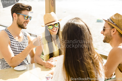 Image of Friends at the beach bar