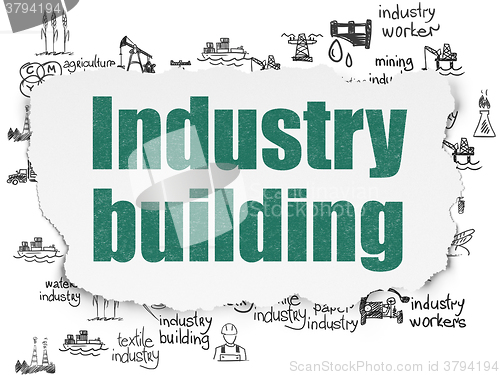 Image of Manufacuring concept: Industry Building on Torn Paper background