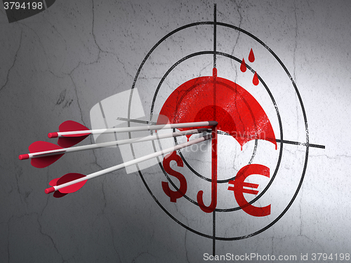 Image of Protection concept: arrows in Money And Umbrella target on wall background
