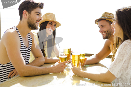 Image of Friends at the beach bar