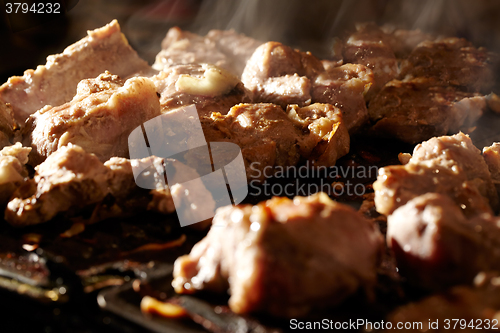 Image of Meat on the BBQ.