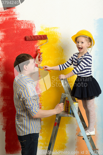 Image of Family fun during wall painting