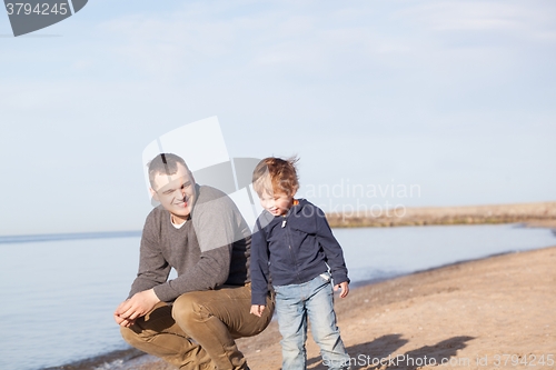 Image of Father with his young son at the beach