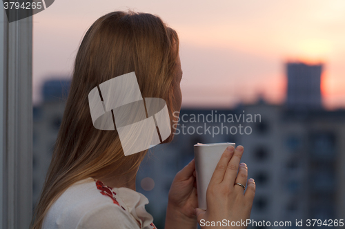 Image of Girl drinking tea