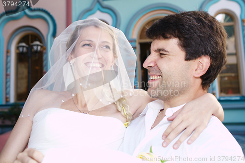 Image of Happy laughing bride and groom