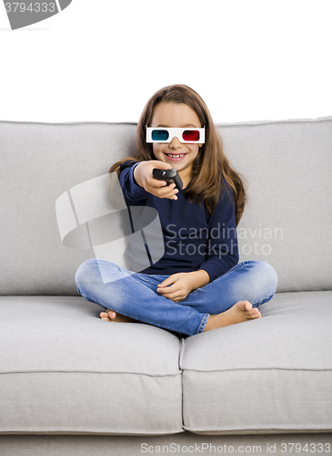 Image of Girl holding a TV remote