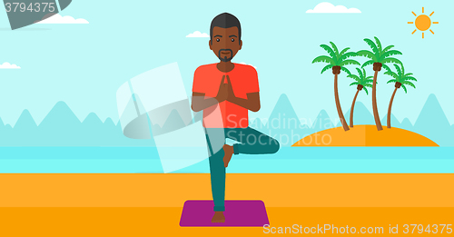 Image of Man practicing yoga.