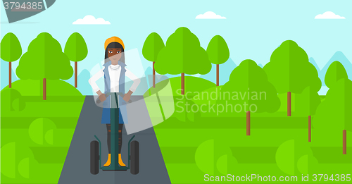 Image of Woman riding on electric scooter.