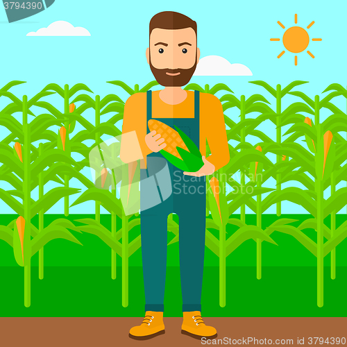 Image of Farmer holding corn.