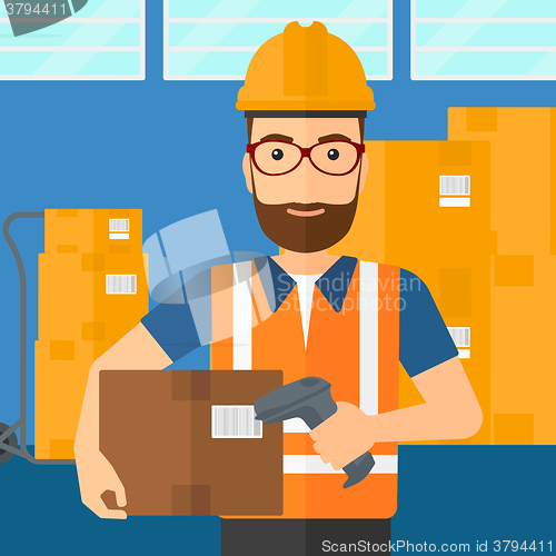 Image of Worker checking barcode on box.