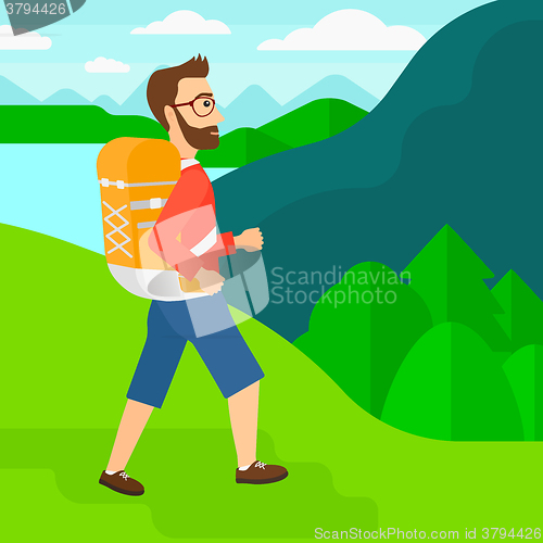 Image of Man with backpack hiking.