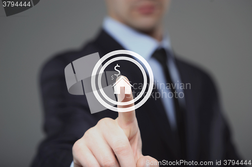 Image of technology and internet concept - businessman pressing House button on virtual screens