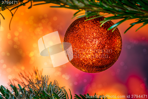 Image of Glittering Christmas bauble in red color