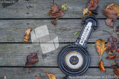 Image of Antique barometer on wooden background