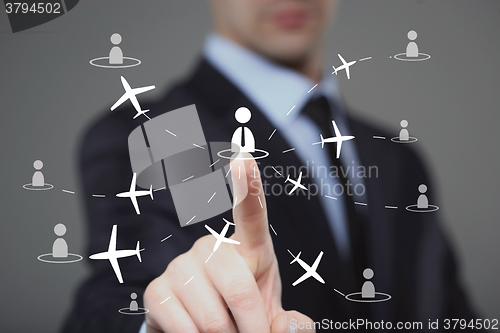 Image of businessman clicks on the icon employee travel.