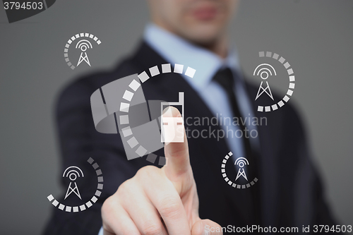 Image of businessman presses radio tower icon . business and technology concept