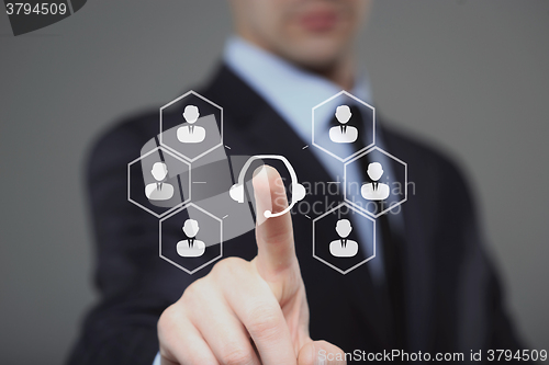 Image of technology, internet and networking concept - businessman pressing service button on virtual screens