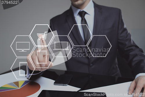 Image of business, technology, internet and networking concept. businessman touching virtual shopping cart.