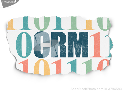 Image of Finance concept: CRM on Torn Paper background