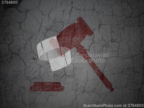 Image of Law concept: Gavel on grunge wall background