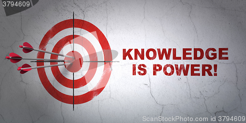 Image of Studying concept: target and Knowledge Is power! on wall background