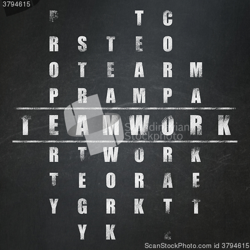 Image of Finance concept: Teamwork in Crossword Puzzle
