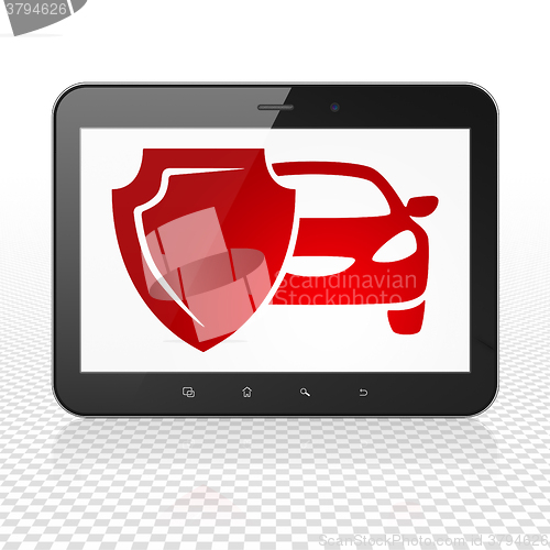 Image of Insurance concept: Tablet Computer with Car And Shield on display