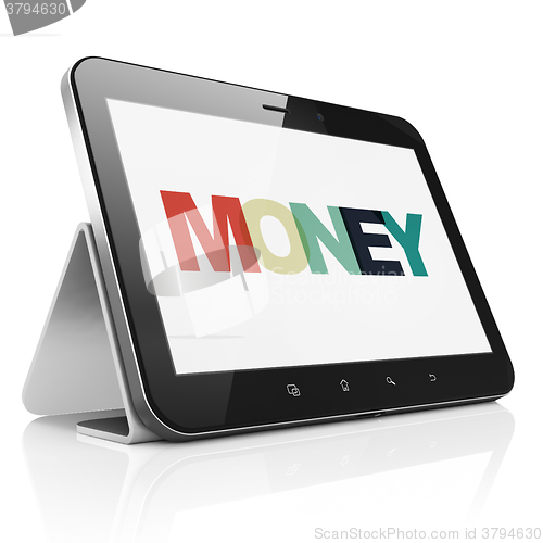 Image of Banking concept: Tablet Computer with Money on  display