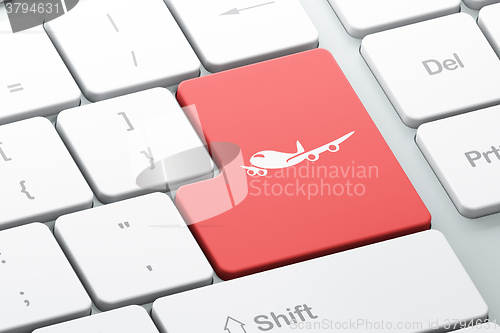 Image of Tourism concept: Airplane on computer keyboard background