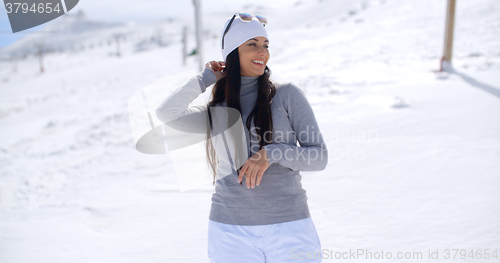 Image of Beautiful woman laughing on ski slope