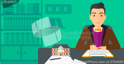 Image of Real estate agent signing contract.
