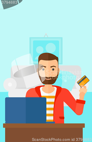 Image of Man making purchases online.