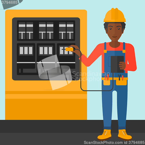 Image of Electrician with electrical equipment.