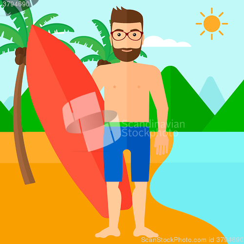 Image of Surfer holding surfboard.