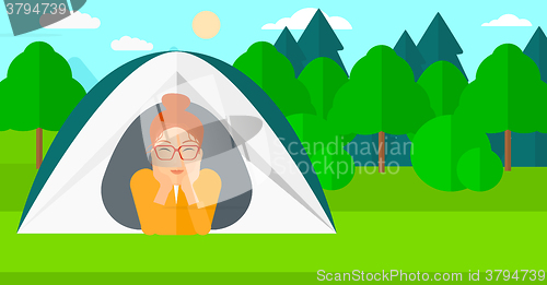 Image of Woman lying in tent.