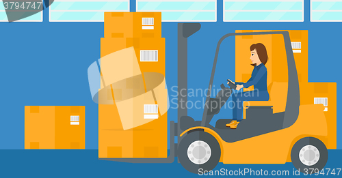 Image of Warehouse worker moving load by forklift truck.