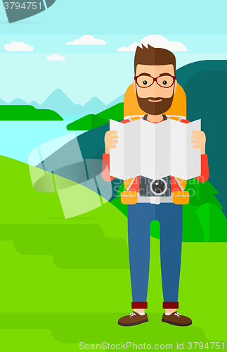 Image of Backpacker looking at map.