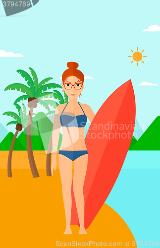 Image of Surfer holding surfboard.