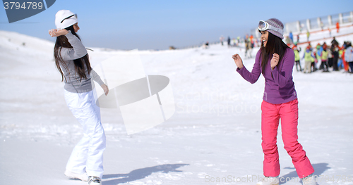 Image of Two young women having a snow fight