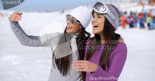 Image of Laughing young woman on winter vacation